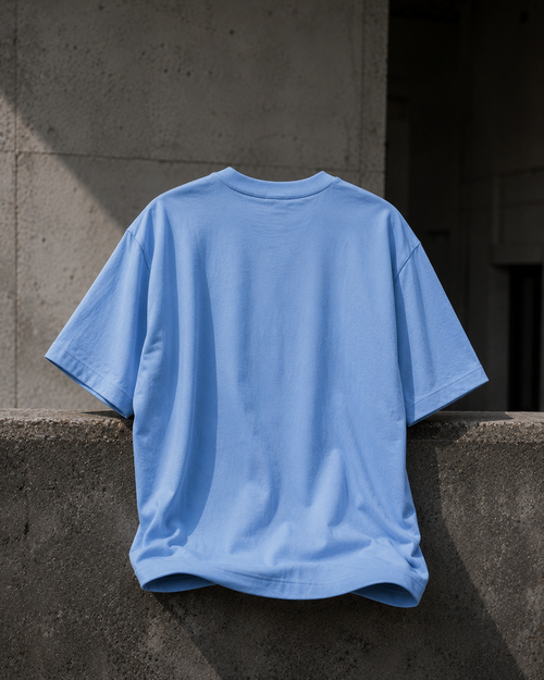 KØMN light blue oversized t-shirt for women back view, relaxed fit 100% cotton heavyweight tee