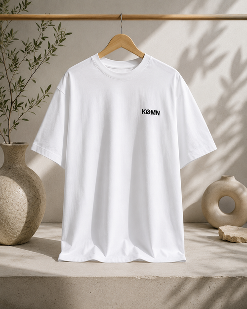 KØMN white oversized t-shirt for men front view with black chest logo, 200 GSM 100% cotton crewneck tee